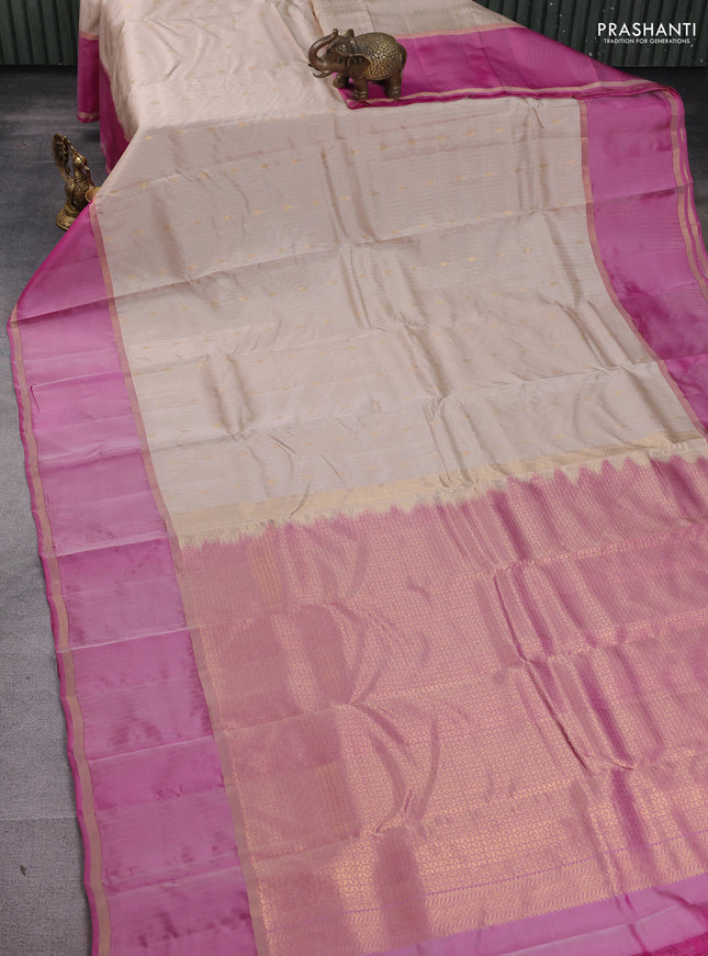 Kanchipuram silk saree beige and pink with allover zari weaves & buttas and zari woven border