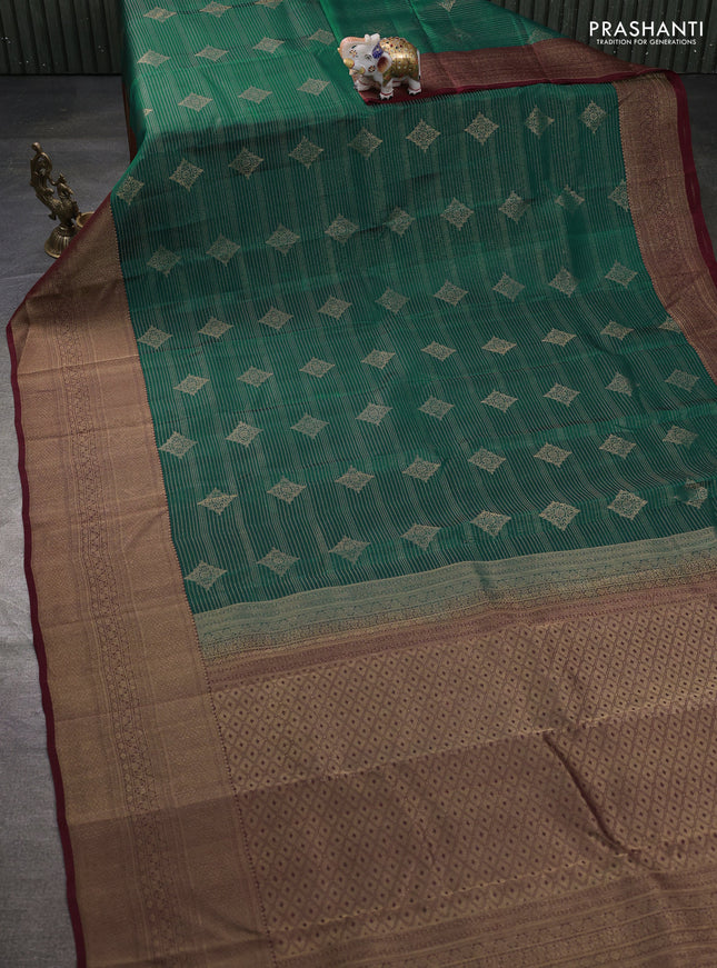Kanchipuram silk saree teal green and maroon with allover zari weaves & buttas and long zari woven border