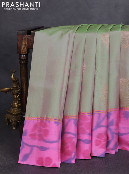 Kanchipuram silk saree dual shade of pastel green and light pink with copper zari woven buttas and zari woven ikat style border