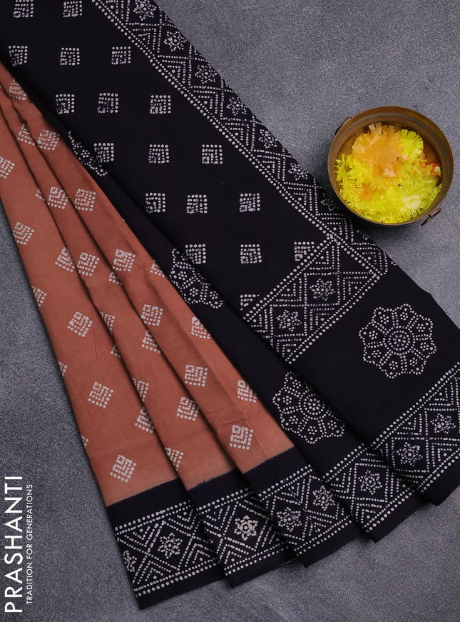 Sungudi cotton saree rust shade and navy blue with allover batik prints and printed border