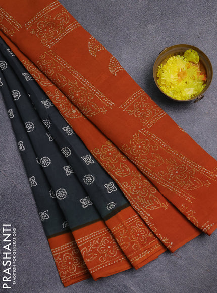 Sungudi cotton saree dark sap green and mustard yellow with allover batik prints and printed border