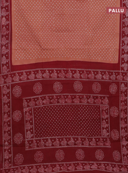 Sungudi cotton saree rust shade and maroon with allover butta prints and printed border