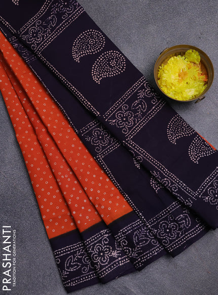Sungudi cotton saree orange and navy blue with allover batik prints and printed border