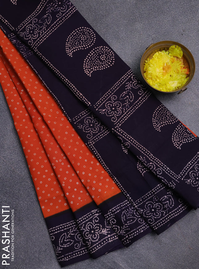 Sungudi cotton saree orange and navy blue with allover batik prints and printed border