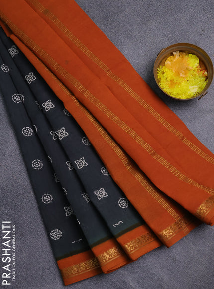 Sungudi cotton saree dark sap green and mustard yellow with allover batik prints and zari woven border
