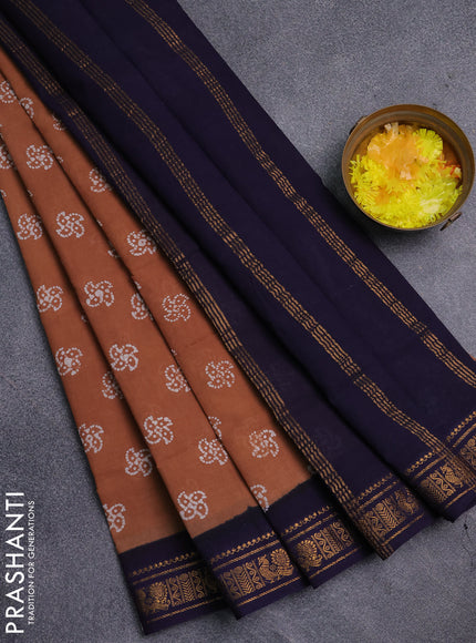 Sungudi cotton saree sandal and navy blue with allover batik prints and zari woven border