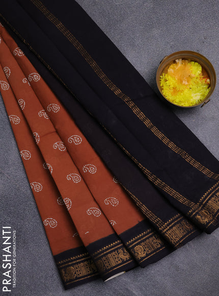 Sungudi cotton saree rust shade and black with allover batik prints and zari woven border