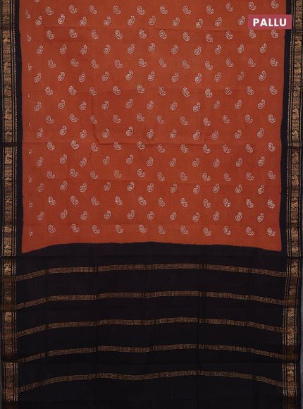 Sungudi cotton saree rust shade and black with allover batik prints and zari woven border
