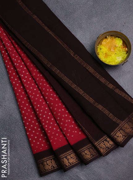 Sungudi cotton saree red and coffee brown with allover batik prints and zari woven border