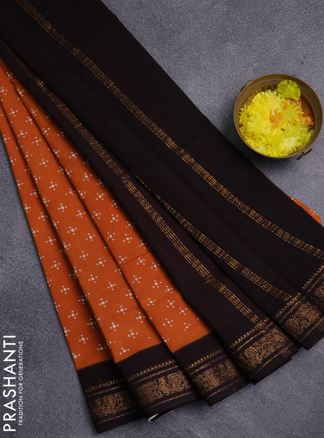 Sungudi cotton saree mustard yellow and coffee brown with allover batik prints and zari woven border