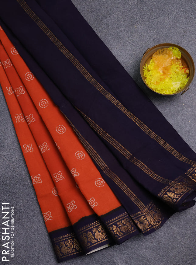 Sungudi cotton saree orange and navy blue with allover batik prints and zari woven border