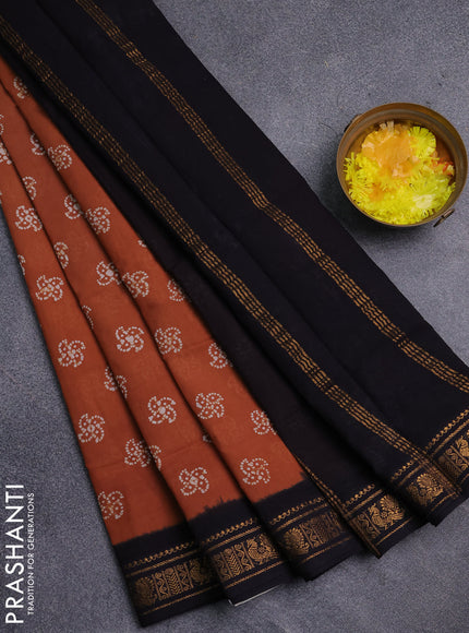 Sungudi cotton saree rust shade and black with allover batik prints and zari woven border