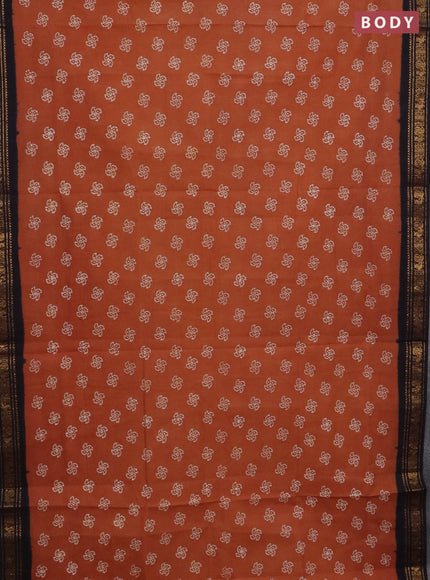 Sungudi cotton saree rust shade and black with allover batik prints and zari woven border
