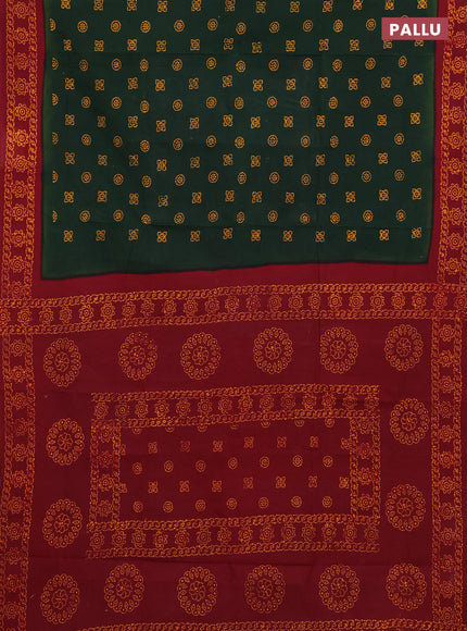 Sungudi cotton saree bottle green and maroon with allover batik prints and zari woven border