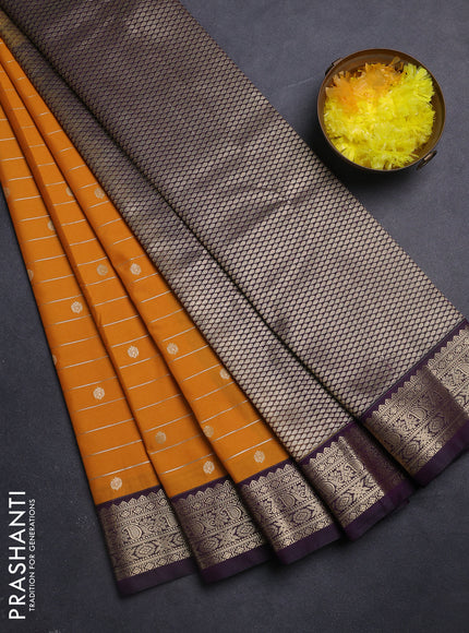 Semi kanchipuram silk saree mango yellow and purple with allover zari weaves & buttas and zari woven korvai border