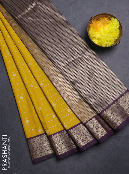 Semi kanchipuram silk saree mustard yellow and purple with allover zari weaves & buttas and zari woven korvai border