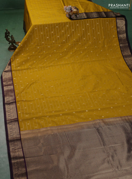 Semi kanchipuram silk saree mustard yellow and purple with allover zari weaves & buttas and zari woven korvai border