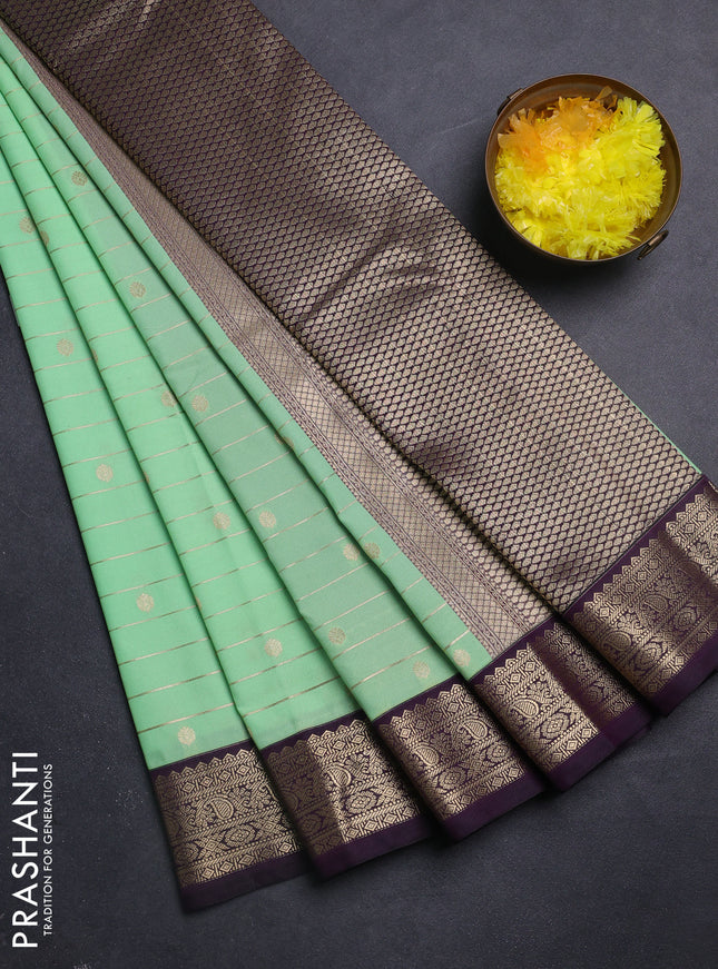 Semi kanchipuram silk saree teal green and purple with allover zari weaves & buttas and zari woven korvai border
