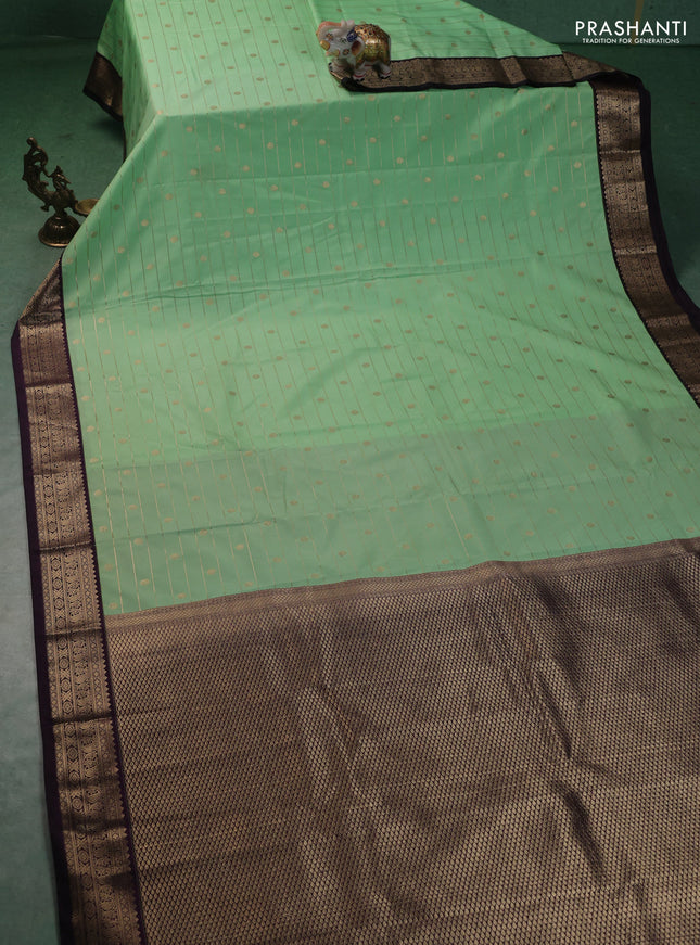 Semi kanchipuram silk saree teal green and purple with allover zari weaves & buttas and zari woven korvai border