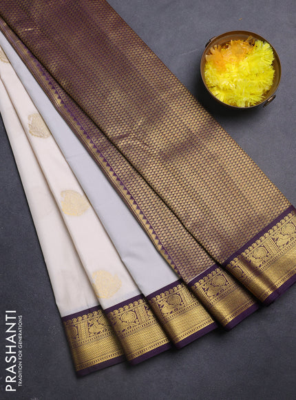 Semi kanchipuram silk saree cream and deep purple with zari woven paisley buttas and zari woven korvai border