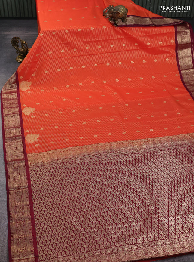 Semi kanchipuram silk saree orange and wine shade with allover zari weaves & buttas and zari woven korvai border