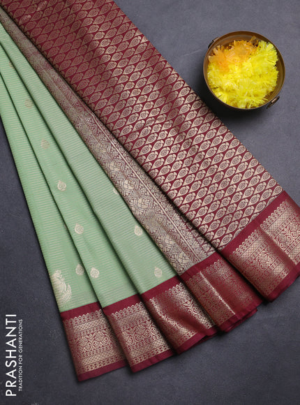 Semi kanchipuram silk saree pastel green and maroon with allover zari weaves & buttas and zari woven korvai border
