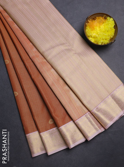 Semi kanchipuram silk saree dark mustard and mild peach with allover small zari checks & buttas and zari woven korvai border