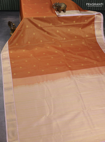Semi kanchipuram silk saree dark mustard and mild peach with allover small zari checks & buttas and zari woven korvai border