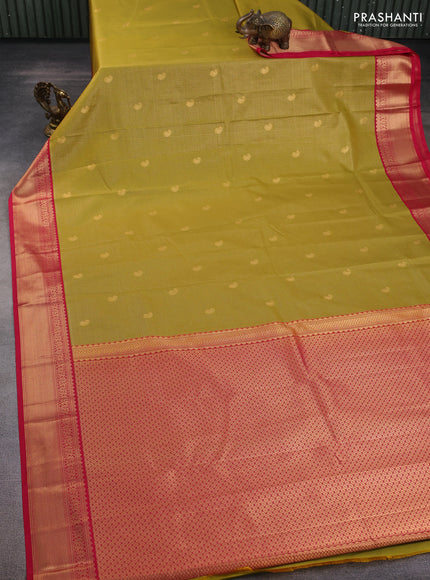 Semi kanchipuram silk saree mustard green and pink with allover small zari checks & buttas and zari woven korvai border
