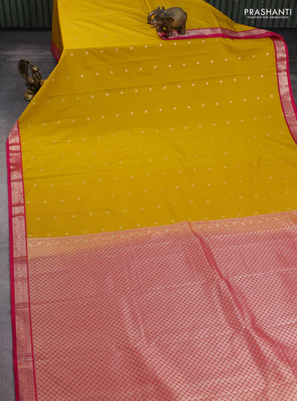 Semi kanchipuram silk saree mango yellow and pink with allover zari woven buttas and zari woven korvai border