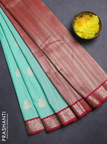 Semi kanchipuram silk saree teal green and red with allover zari woven butta weaves and zari woven korvai border