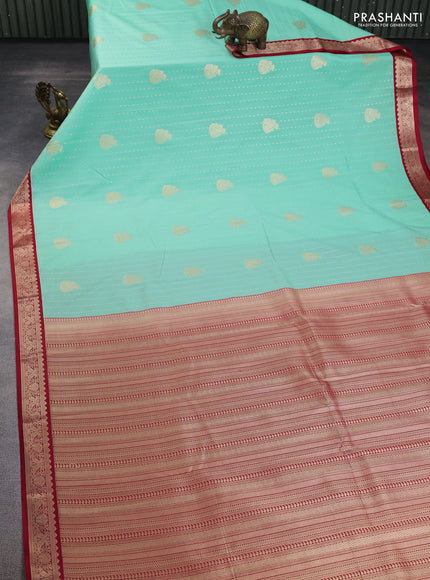 Semi kanchipuram silk saree teal green and red with allover zari woven butta weaves and zari woven korvai border