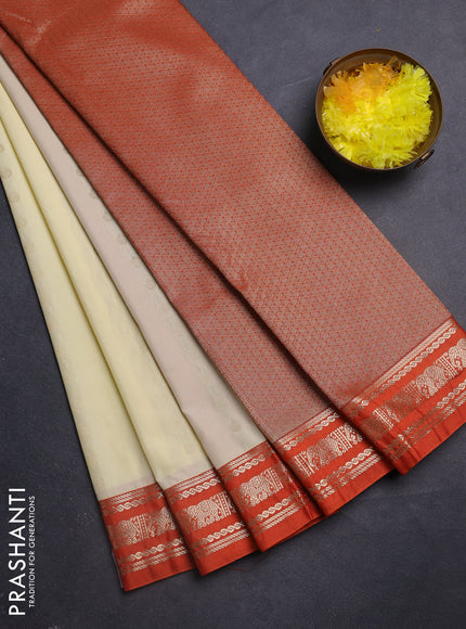 Semi kanchipuram silk saree cream and orange with allover zari woevn buttas and zari woven korvai border
