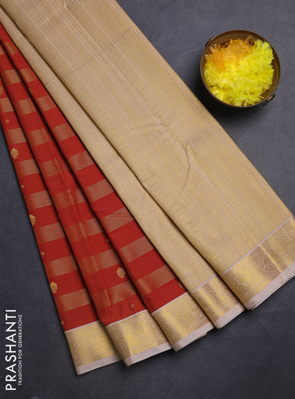 Semi kanchipuram silk saree rust shade and sandal with allover zari weaves & buttas and zari woven korvai border