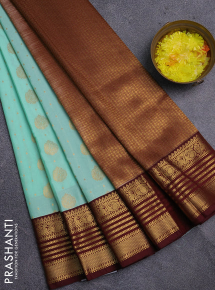 Semi kanchipuram silk saree teal green shade and deep maroon with allover zari woven buttas and zari woven korvai border