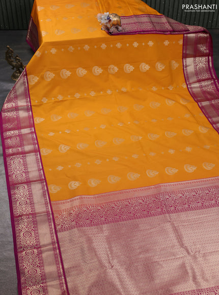 Semi kanchipuram silk saree mango yellow and purple with zari woven buttas and zari woven korvai border