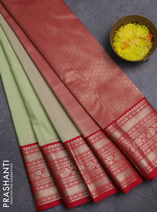 Semi kanchipuram silk saree pista green and pink with zari woven buttas and zari woven korvai border