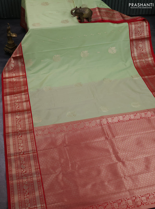 Semi kanchipuram silk saree pista green and pink with zari woven buttas and zari woven korvai border