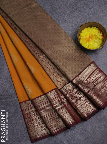 Semi kanchipuram silk saree dark mustard and deep maroon with zari woven buttas and long zari woven korvai border