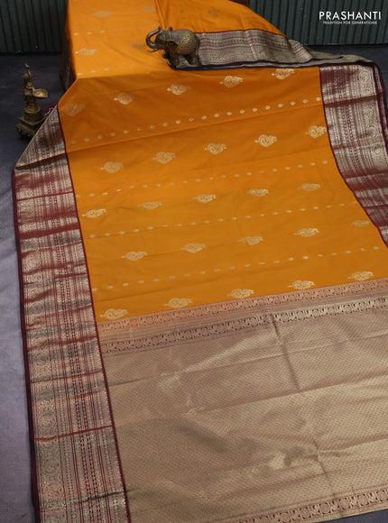 Semi kanchipuram silk saree dark mustard and deep maroon with zari woven buttas and long zari woven korvai border