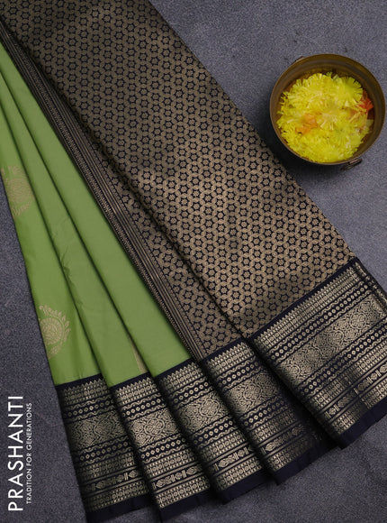 Semi kanchipuram silk saree pista green and navy blue with allover zari weaves & buttas and zari woven korvai border