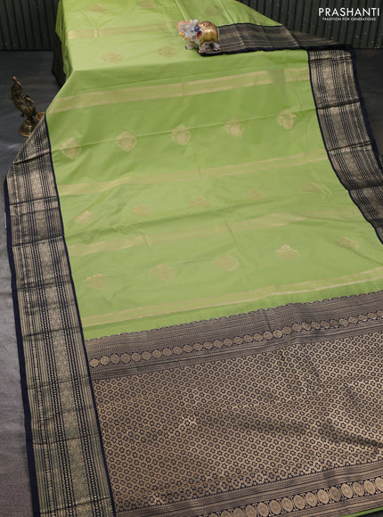 Semi kanchipuram silk saree pista green and navy blue with allover zari weaves & buttas and zari woven korvai border