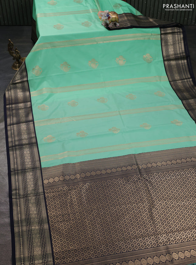 Semi kanchipuram silk saree teal green and navy blue with allover zari weaves & buttas and zari woven korvai border