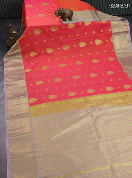 Semi kanchipuram silk saree dual shade of pinkish yellow and pastel pink with zari woven buttas and zari woven korvai border