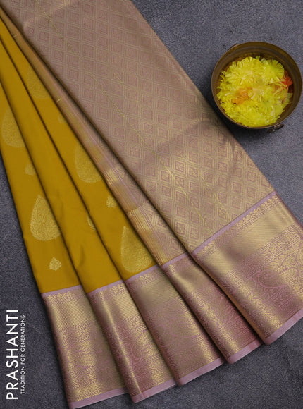 Semi kanchipuram silk saree yellow and pastel pink with zari woven buttas and zari woven korvai border