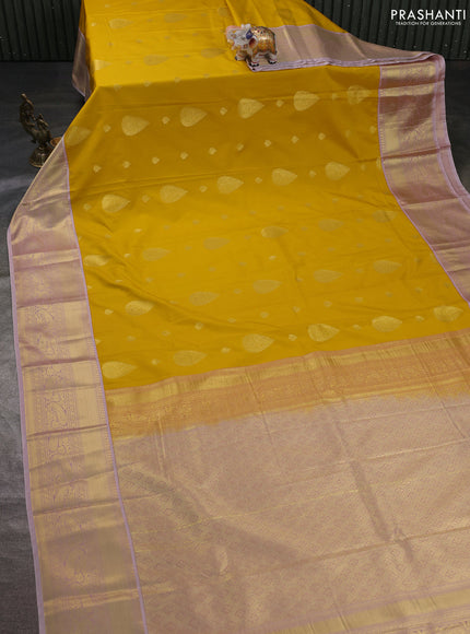 Semi kanchipuram silk saree yellow and pastel pink with zari woven buttas and zari woven korvai border
