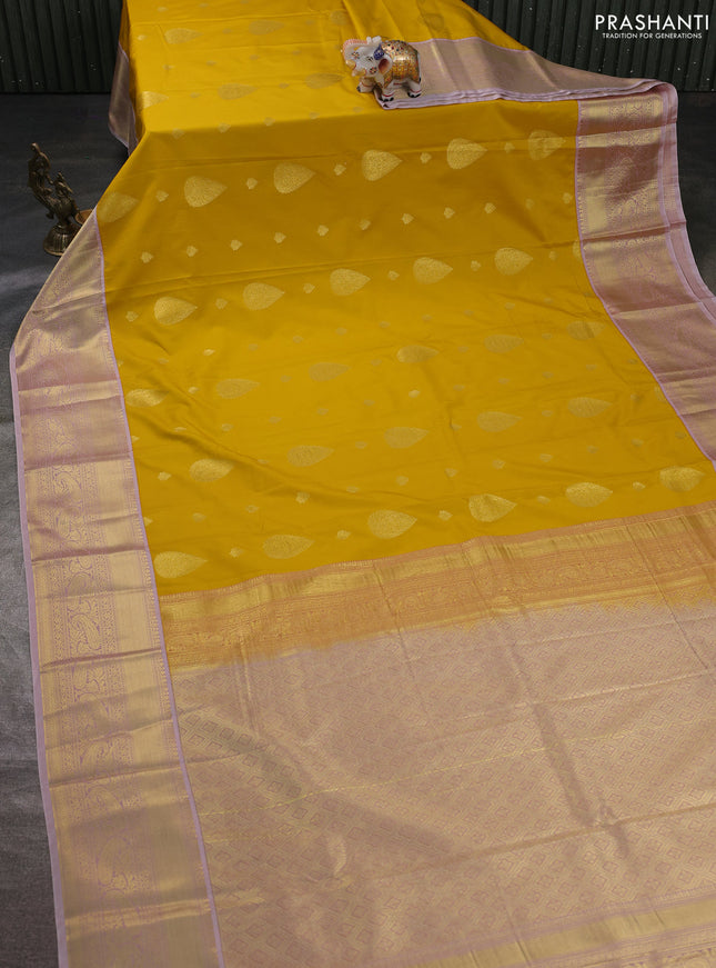 Semi kanchipuram silk saree yellow and pastel pink with zari woven buttas and zari woven korvai border