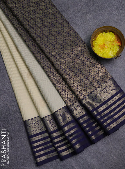 Semi kanchipuram silk saree cream and navy blue with allover small zari checks & buttas and zari woven korvai border