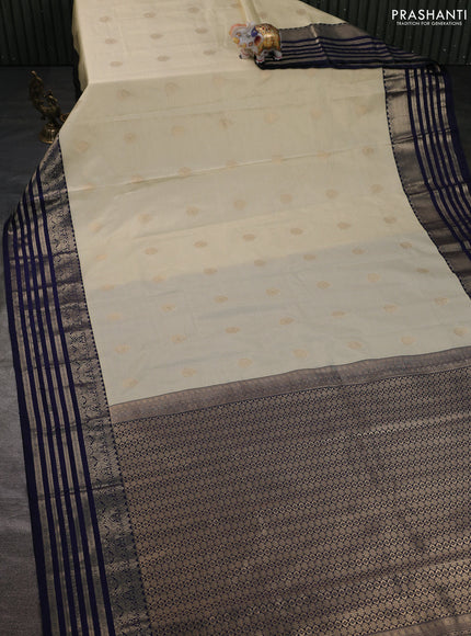 Semi kanchipuram silk saree cream and navy blue with allover small zari checks & buttas and zari woven korvai border