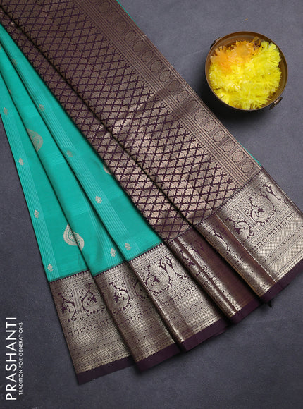 Semi kanchipuram silk saree teal green and wine shade with allover self emboss checks & zari buttas and rich zari woven border